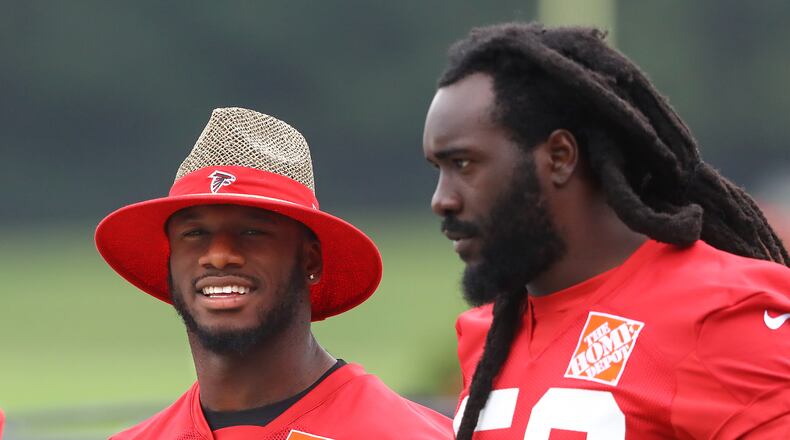 Deion Jones (left) and De'Vondre Campbell arrive for the first day of mandatory minicamp in Flowery Branch earlier this summer. Curtis Compton/ccompton@ajc.com