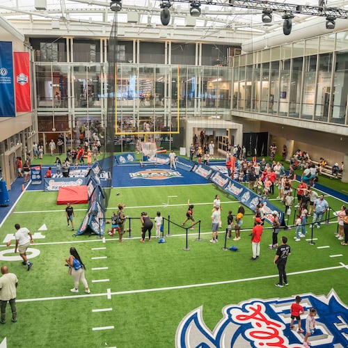 The 45-foot field at the heart of the College Football Hall of Fame gives guests the opportunity to kick field goals, throw passes and time their sprints. (Photo courtesy of College Football Hall of Fame.)