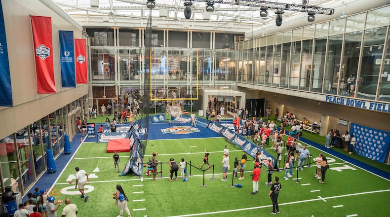 The 45-foot field at the heart of the College Football Hall of Fame gives guests the opportunity to kick field goals, throw passes and time their sprints. (Photo courtesy of College Football Hall of Fame.)