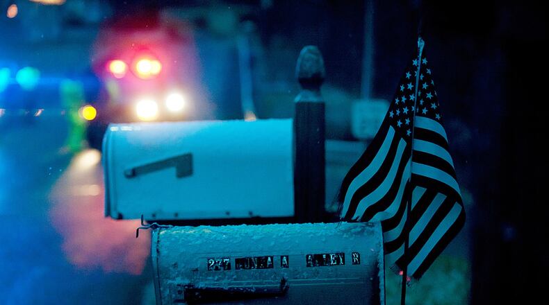 A Connecticut woman uses a pulley to bring her mailbox to her front porch.