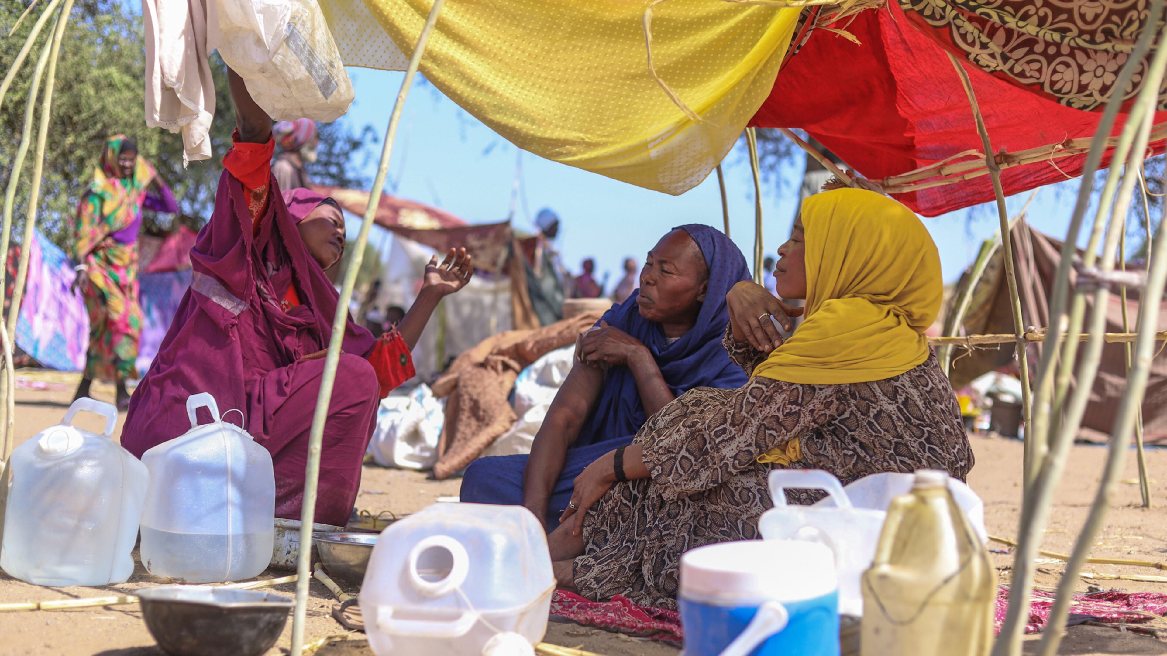 Sudanese who fled el-Fasher city, after Sudan's paramilitary forces killed hundreds of people in the western Darfur region, speak at their camp in Tawila, Sudan, Wednesday, Oct. 29, 2025. (AP Photo/Muhnnad Adam)