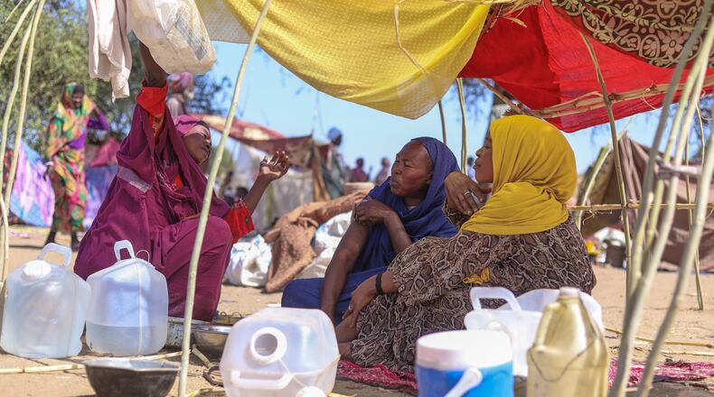 Sudanese who fled el-Fasher city, after Sudan's paramilitary forces killed hundreds of people in the western Darfur region, speak at their camp in Tawila, Sudan, Wednesday, Oct. 29, 2025. (AP Photo/Muhnnad Adam)
