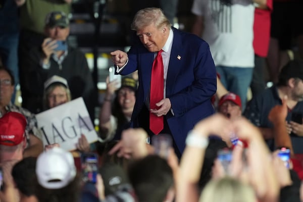 President Donald Trump gestures after speaking at Macomb Community College, Tuesday, April 29, 2025, in Warren Mich. (AP Photo/Paul Sancya)