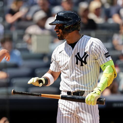 New York Yankees' José Caballero reacts after striking out in front of home plate umpire Quinn Wolcott (81) in the sixth inning during the first baseball game of a doubleheader against the Pittsburgh Pirates, Wednesday, July 22, 2026, in New York. (AP Photo/Adam Hunger)