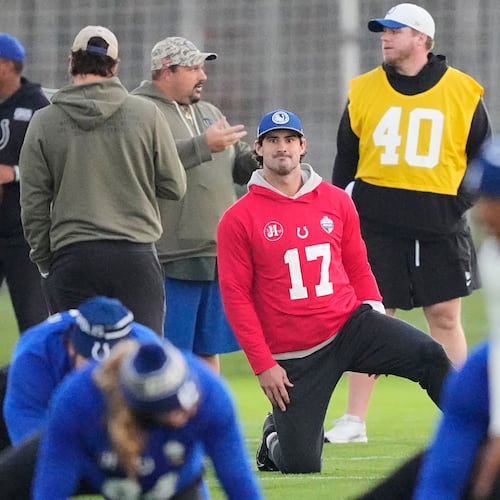 Indianapolis Colts quarterback Daniel Jones (17) stretches during a training session in Berlin, Germany, Friday, Nov. 7, 2025, ahead of Sunday's NFL football game against the Atlanta Falcons. (AP Photo/Martin Meissner)