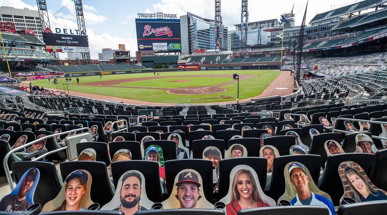 Cut-out fans located behind home base have been adjusted in their seats to prevent glare on the players against the Boston Red Sox Sunday, Sept. 27, 2020, at Truist Park in Atlanta. (Alyssa Pointer / Alyssa.Pointer@ajc.com)