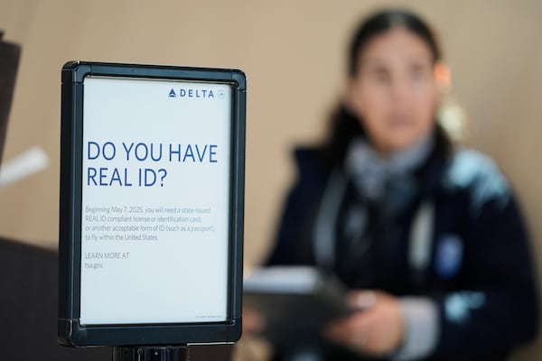 A sign displays information about Real ID at Newark Liberty International Airport in Newark, N.J., Wednesday, May 7, 2025. (AP Photo/Seth Wenig)