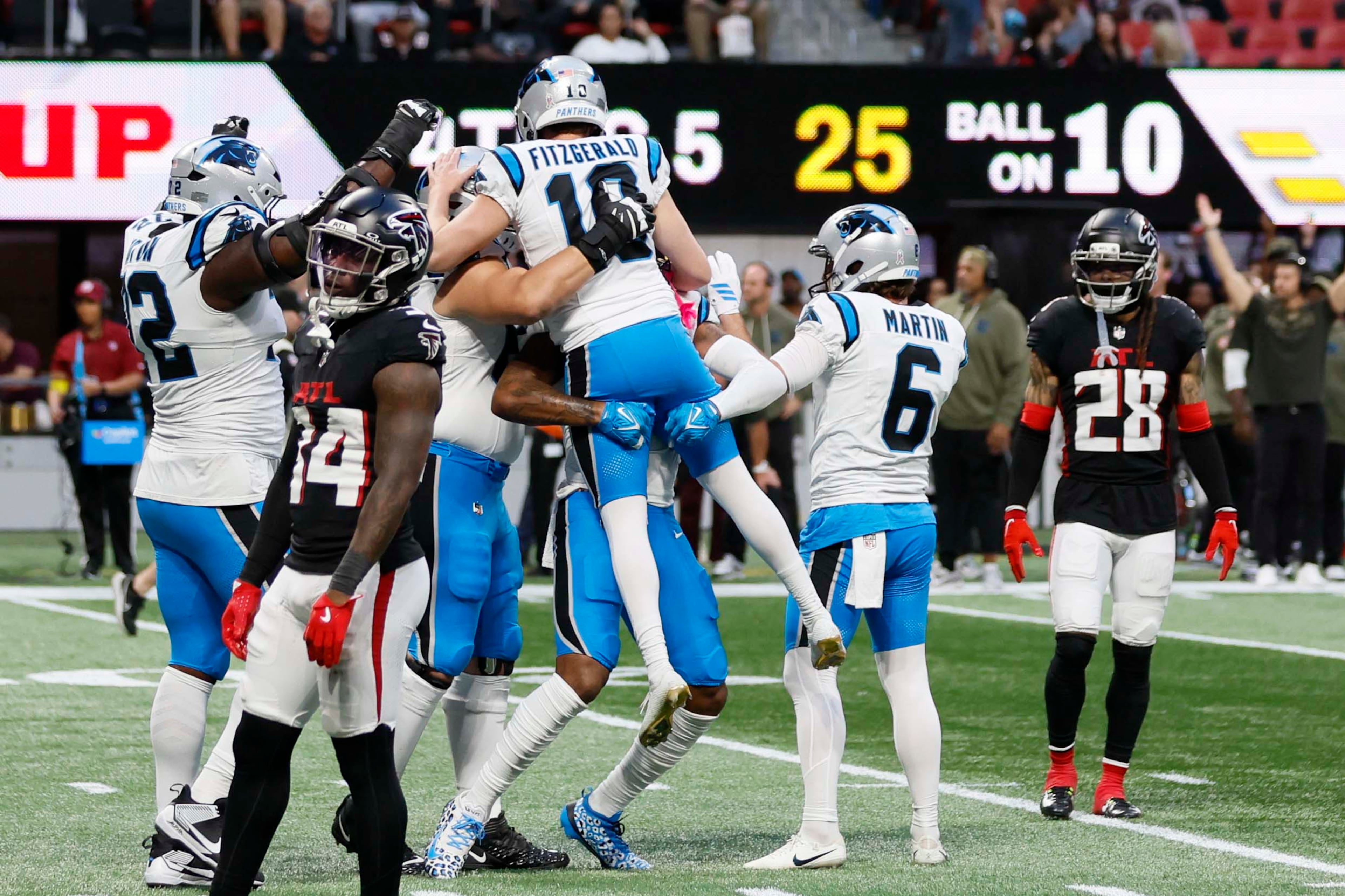 Carolina Panthers players celebrate with place kicker Ryan Fitzgerald (third from right) after he makes the game-winning field goal to beat the Atlanta Falcons 30-27 in overtime at Mercedes-Benz Stadium in Atlanta on Sunday, Nov. 16, 2025.
(Miguel Martinez/AJC)