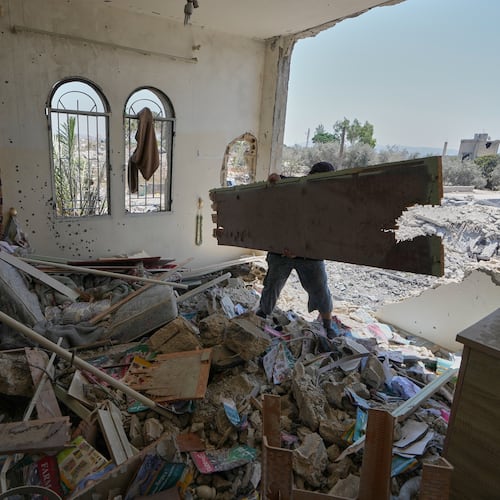 A Lebanese man removes debris from his destroyed house in the village of Zawtar al-Gharbieh, south Lebanon, Wednesday, Aug. 5, 2026. (AP Photo/Mohammed Zaatari)