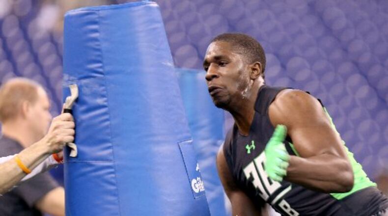 Vanderbilt linebacker Stephen Weatherly performs a drill at the NFL football scouting combine Sunday, Feb. 28, 2016, in Indianapolis. (AP Photo/Gregory Payan)