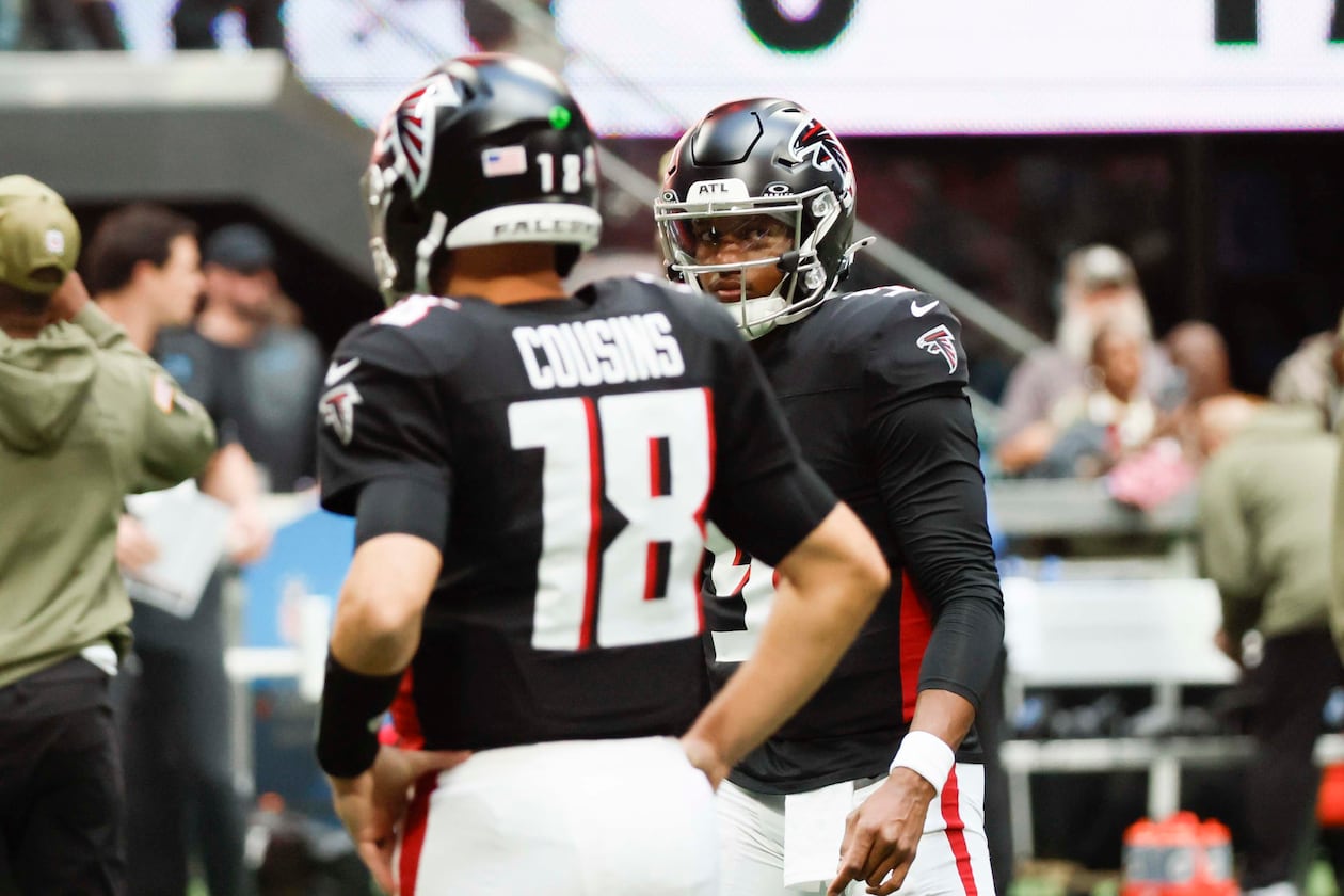Atlanta Falcons quarterback Michael Penix Jr. (9) looks at Atlanta Falcons quarterback Kirk Cousins (18) during warm-ups before the game against the Carolina Panthers at Mercedes-Benz Stadium on Sunday, Nov. 16, 2025, in Atlanta.
(Miguel Martinez/ AJC)