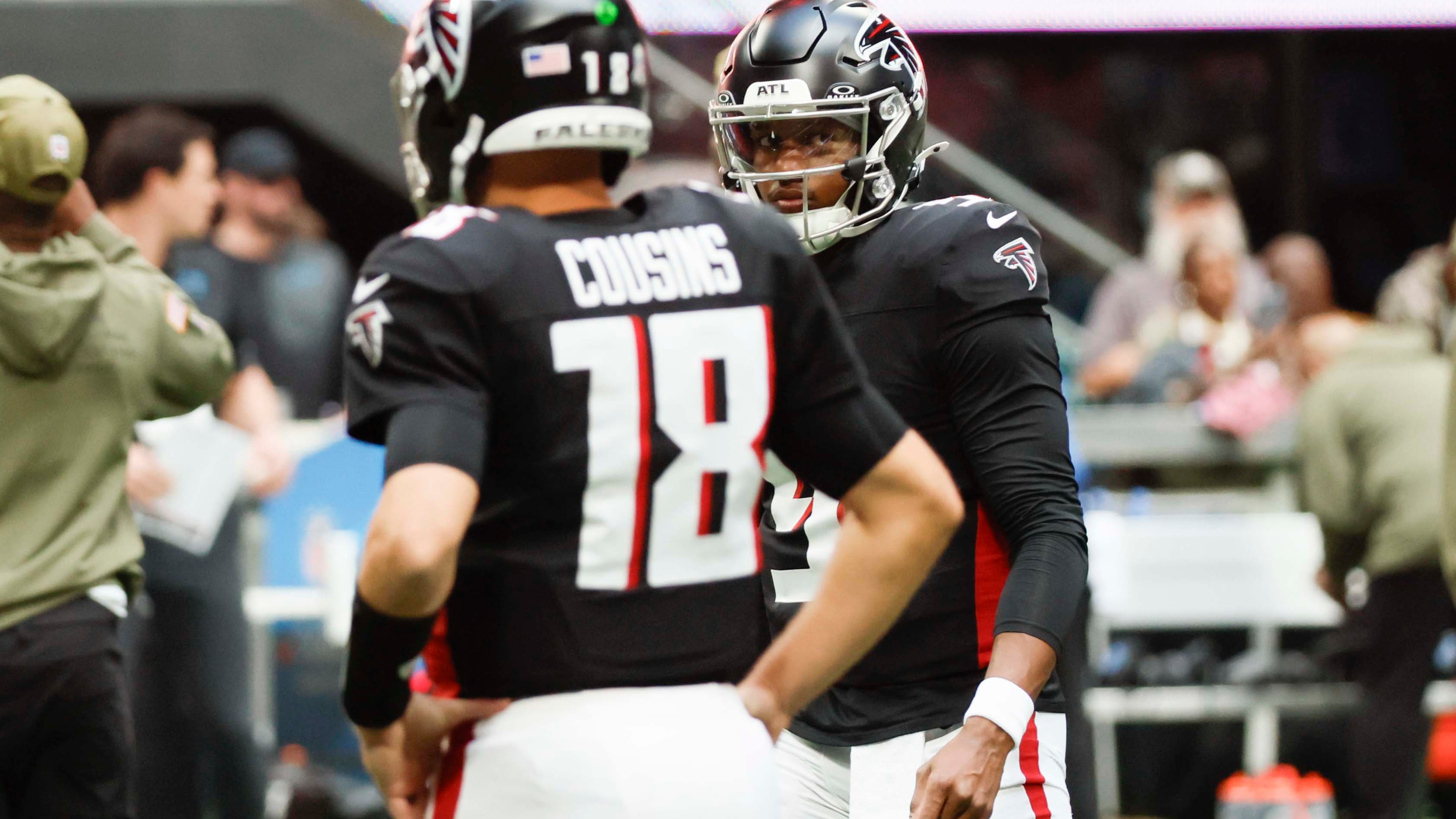 Atlanta Falcons quarterback Michael Penix Jr. (9) looks at Atlanta Falcons quarterback Kirk Cousins (18) during warm-ups before the game against the Carolina Panthers at Mercedes-Benz Stadium on Sunday, Nov. 16, 2025, in Atlanta.
(Miguel Martinez/ AJC)