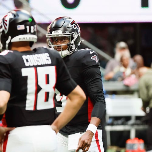 Atlanta Falcons quarterback Michael Penix Jr. (9) looks at Atlanta Falcons quarterback Kirk Cousins (18) during warm-ups before the game against the Carolina Panthers at Mercedes-Benz Stadium on Sunday, Nov. 16, 2025, in Atlanta.
(Miguel Martinez/ AJC)