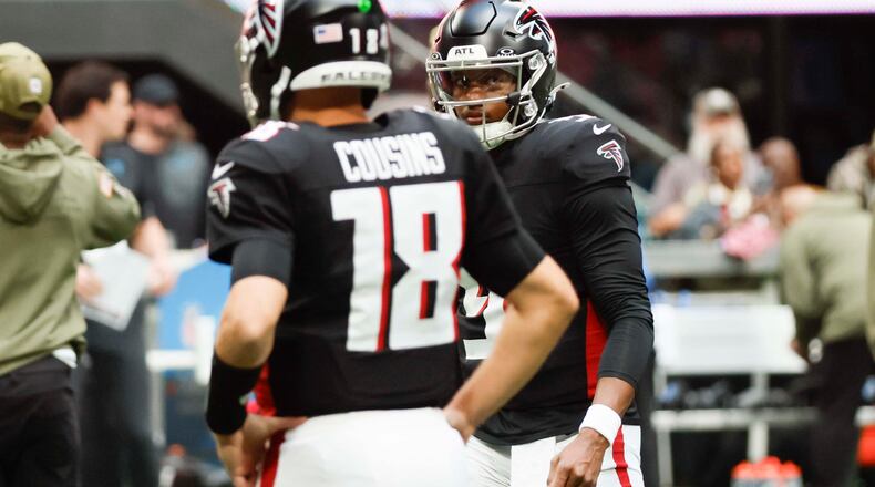 Atlanta Falcons quarterback Michael Penix Jr. (9) looks at Atlanta Falcons quarterback Kirk Cousins (18) during warm-ups before the game against the Carolina Panthers at Mercedes-Benz Stadium on Sunday, Nov. 16, 2025, in Atlanta.
(Miguel Martinez/ AJC)