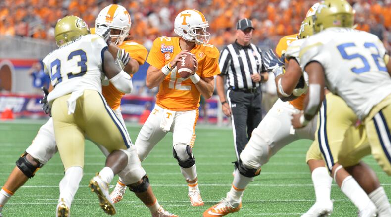 September 4, 2017 Atlanta - Tennessee quarterback Quinten Dormady (12) prepares to get off a pass in the first half of NCAA college football game at the Mercedes-Benz Stadium on Monday, September 4, 2017. (HYOSUB SHIN / HSHIN@AJC.COM)