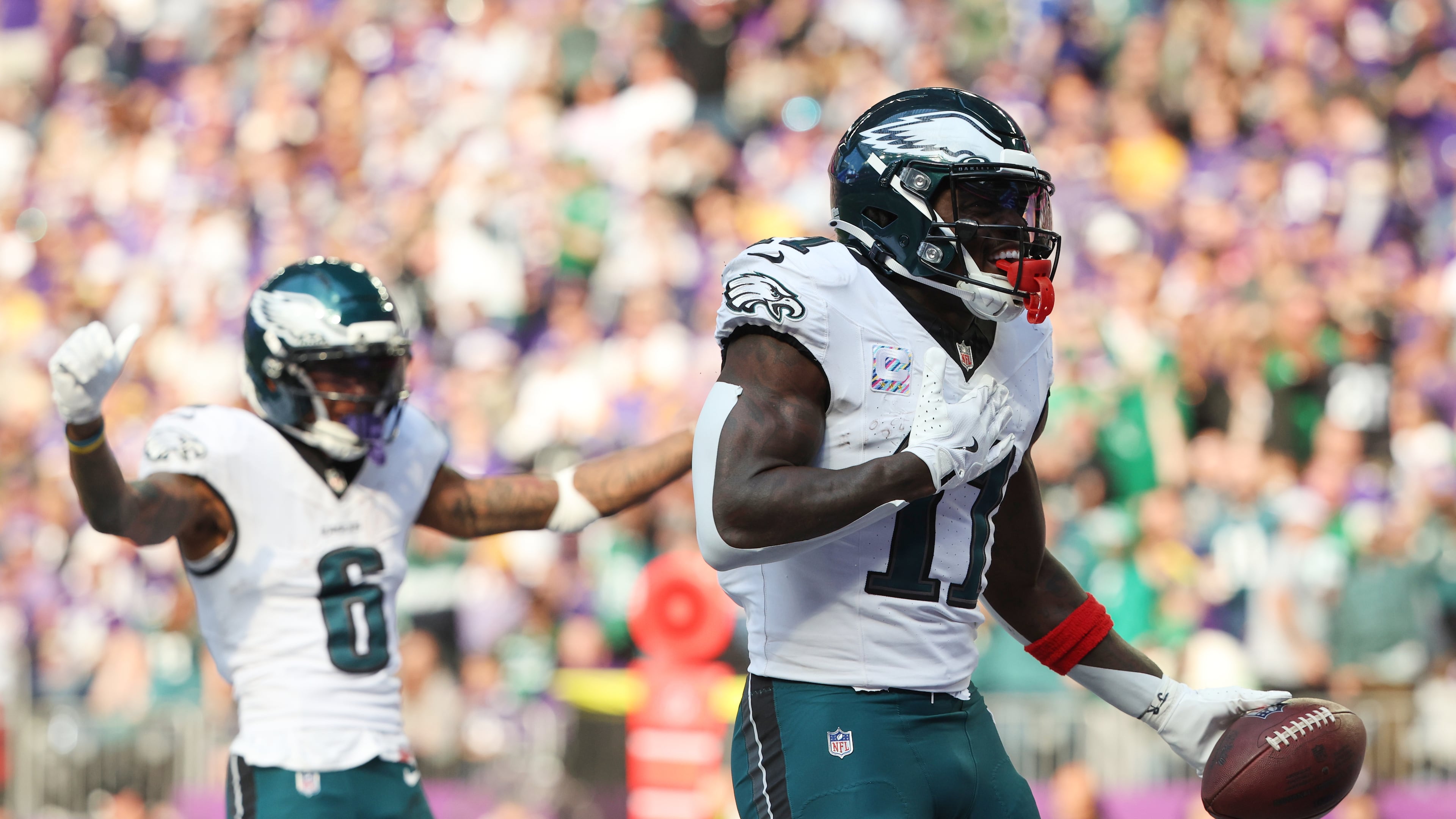 Philadelphia Eagles wide receiver A.J. Brown (11) celebrates his touchdown catch during the second half of an NFL football game against the Minnesota Vikings, Sunday, Oct. 19, 2025, in Minneapolis. (AP Photo/Ellen Schmidt)