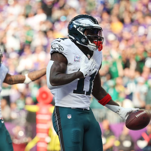 Philadelphia Eagles wide receiver A.J. Brown (11) celebrates his touchdown catch during the second half of an NFL football game against the Minnesota Vikings, Sunday, Oct. 19, 2025, in Minneapolis. (AP Photo/Ellen Schmidt)