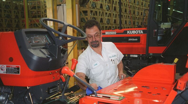 Assembly manager Greg Smith oversees the building a medium-size Kubota tractor. Kubota sent 2.700 employees home Tuesday because of the effects of the coronavirus. (AJC Staff Photo/Peter Kent)
