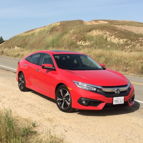 This photo provided by Honda shows the 2016 Civic, a longtime popular choice for a small sedan that offers peppy acceleration and solid fuel economy as well as solid construction. Aim to find a 2016 Civic, the year it received a redesign and a new optional turbocharged engine. (Courtesy of Edmunds via AP)