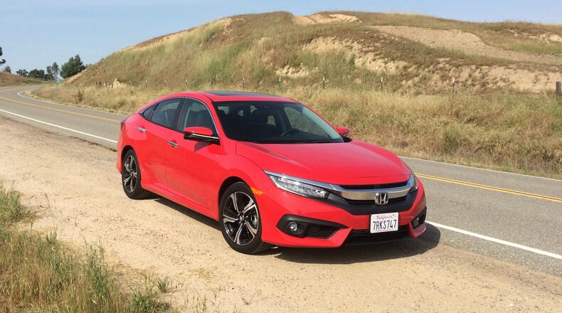 This photo provided by Honda shows the 2016 Civic, a longtime popular choice for a small sedan that offers peppy acceleration and solid fuel economy as well as solid construction. Aim to find a 2016 Civic, the year it received a redesign and a new optional turbocharged engine. (Courtesy of Edmunds via AP)