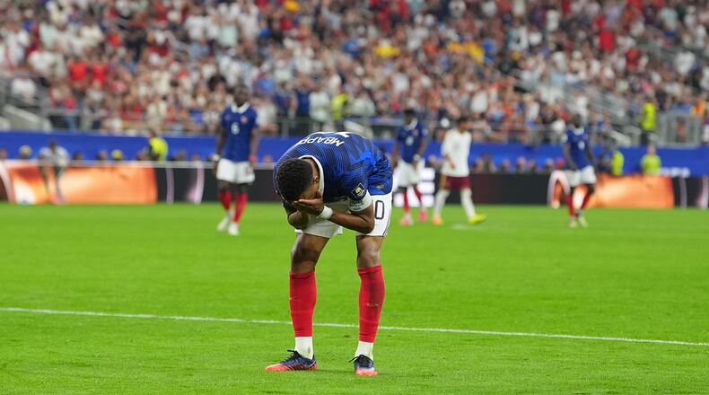 France's Kylian Mbappe reacts during a World Cup semifinal soccer match against Spain in Arlington, Texas, near Dallas, Tuesday, July 14, 2026. (AP Photo/Julio Cortez)