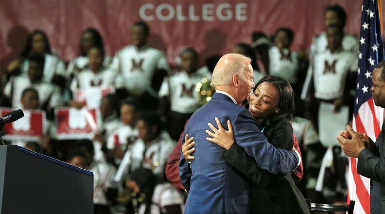 Then-Vice President Joe Biden gets a hug from VenKayla Haynes after his speech at Morehouse College during a three-college tour to mobilize students to take action to prevent sexual assault on campuses in 2015. (Curtis Compton / AJC file photo)