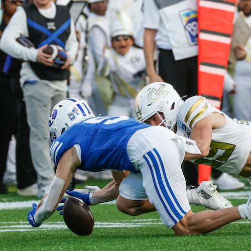 Georgia Tech defensive back Will Kiker (right) recovers a fumble dropped by BYU wide receiver Cody Hagen (left) during the first half of the Pop-Tarts Bowl game, Saturday, Dec. 27, 2025, in Orlando, Fla. (Kevin Kolczynski/AP)