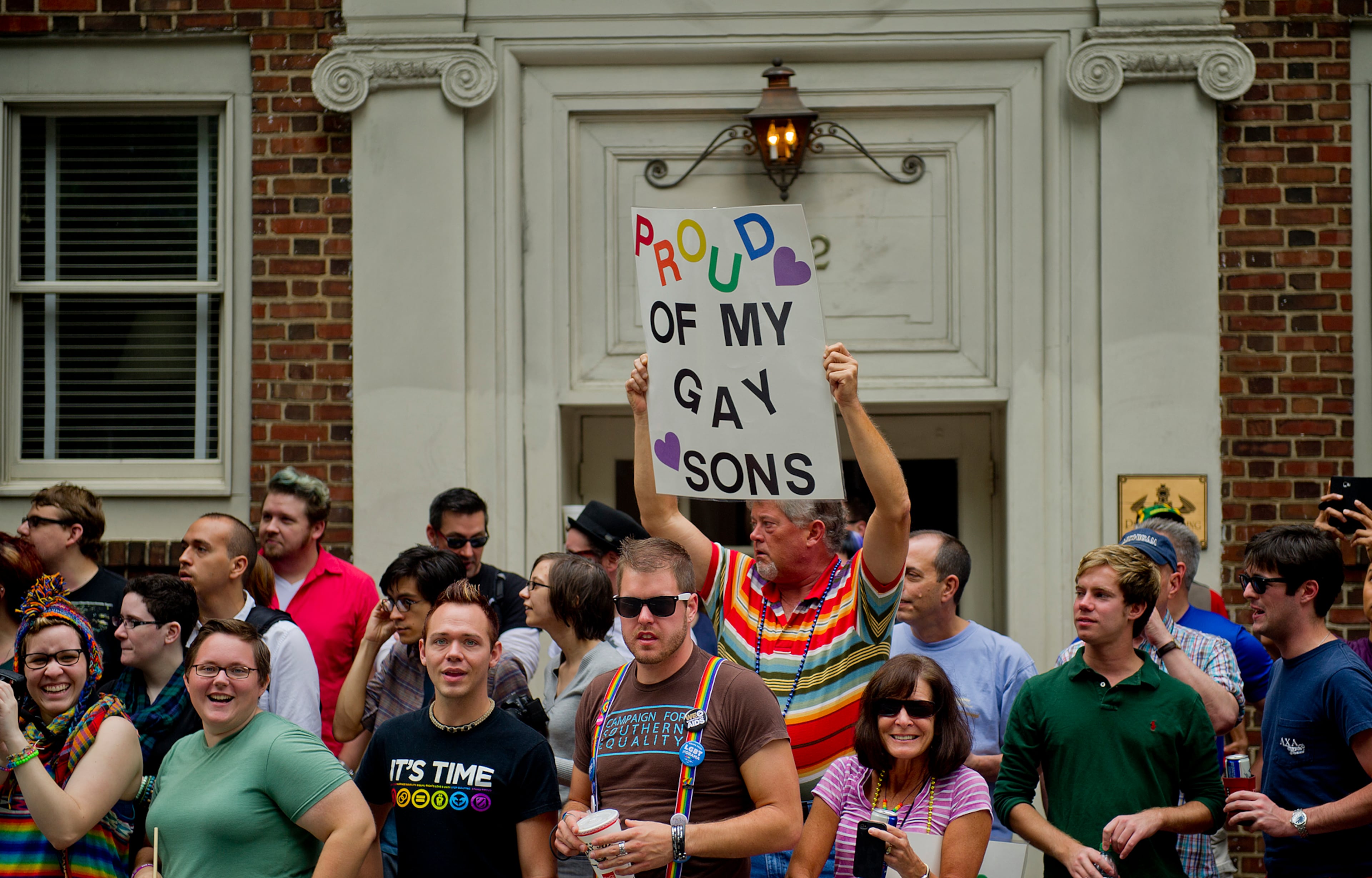 Deck Neisler holds up a sign during the Atlanta Pride Parade on Sunday, Oct. 14, 2012. Thousands of people came out to watch the parade that wound its way through downtown and ended in Piedmont Park.