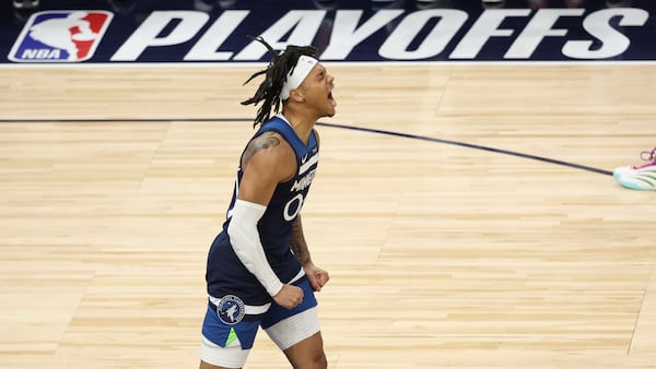Minnesota Timberwolves guard Terrence Shannon Jr. (00) celebrates during the first half of Game 3 of the Western Conference finals of the NBA basketball playoffs against the Oklahoma City Thunder, Saturday, May 24, 2025, in Minneapolis. (AP Photo/Matt Krohn)