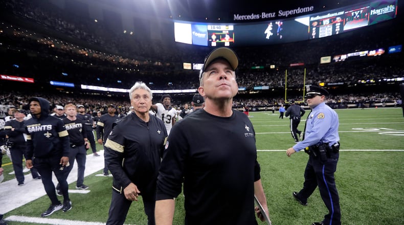 New Orleans Saints head coach Sean Payton looks up as he walks off the field after overtime of an NFL wild-card playoff football game against the Minnesota Vikings, Sunday, Jan. 5, 2020, in New Orleans. The Vikings won 26-20.