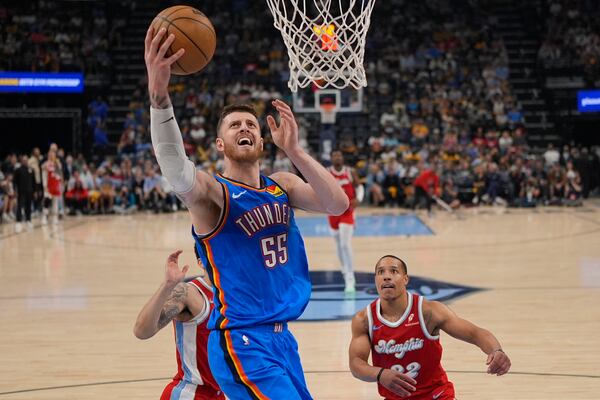 Oklahoma City Thunder center Isaiah Hartenstein (55) shoots the ball over Memphis Grizzlies guard Desmond Bane (22) during the first half in Game 4 of an NBA basketball first-round playoff series Saturday, April 26, 2025, in Memphis, Tenn. (AP Photo/George Walker IV)