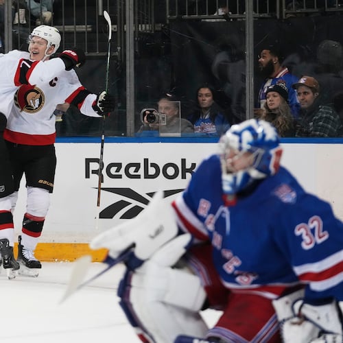 Ottawa Senators' Brady Tkachuk, center, celebrates with teammate Thomas Chabot, left, after scoring a goal as New York Rangers goaltender Jonathan Quick (32) looks away during the first period of an NHL hockey game Wednesday, Jan. 14, 2026, in New York. (AP Photo/Frank Franklin II)