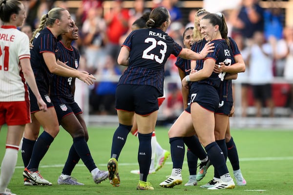 United States forward Sam Coffey, right, celebrates her goal with defender Lilly Reale (23) and others during the first half of an international friendly soccer match against Canada, Wednesday, July 2, 2025, in Washington. (AP Photo/Nick Wass)