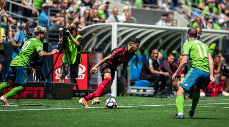 Seattle Sounders defenders converge on Atlanta United during match Sunday, July 14, 2019, at CenturyLink Field in Seattle.