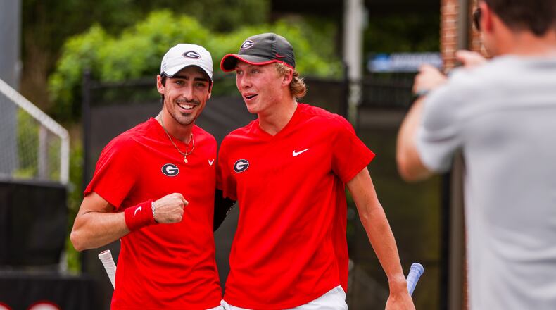 Georgia tennis players Thomas Paulsell (L), and Ethan Quinn celebrate winning n NCAA tournament match against Oklahoma in the second round May 7 at UGA's Dan Magill Tennis Complex. (Tony Walsh/UGA Athletics)