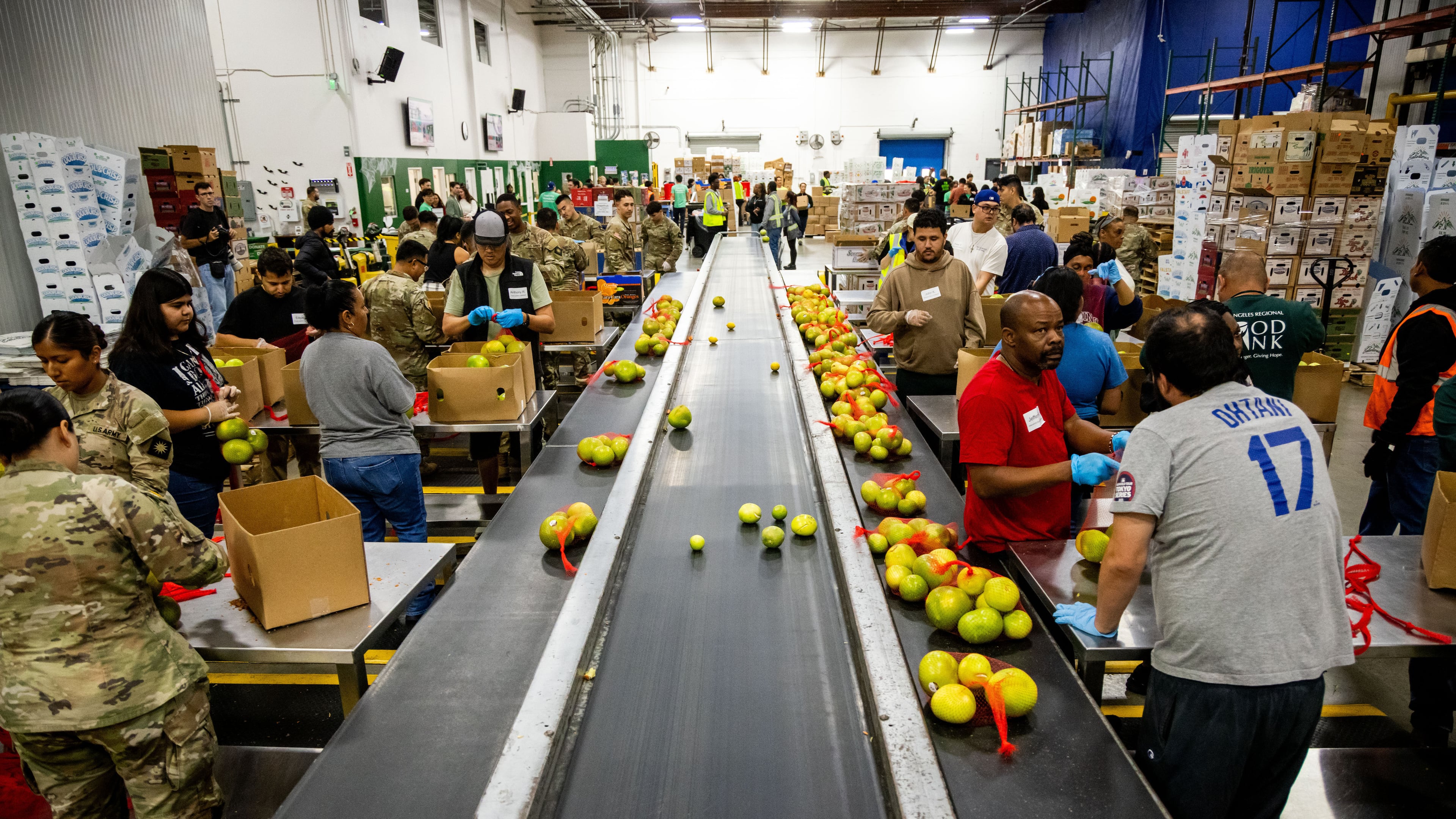 California National Guard sort produce at the Los Angeles Food Bank Wednesday, Oct. 29, 2025, in Los Angeles. (AP Photo/Ethan Swope)