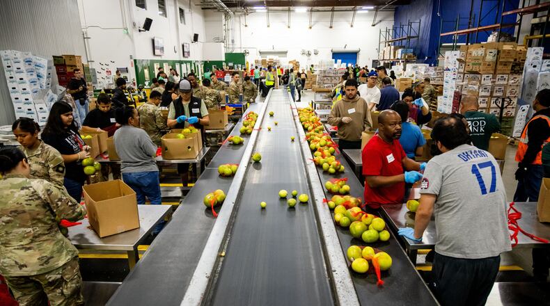 California National Guard sort produce at the Los Angeles Food Bank Wednesday, Oct. 29, 2025, in Los Angeles. (AP Photo/Ethan Swope)