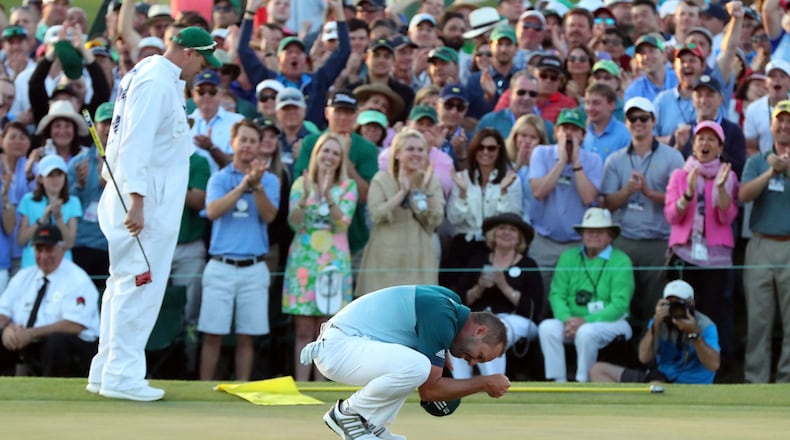 An emotional Sergio Garcia celebrates after winning the Masters in a one-hole playoff Sunday over Justin Rose at Augusta National Golf Club. It was the first major win in Garcia’s 74th attempt. (Curtis Compton/ccompton@ajc.com)
