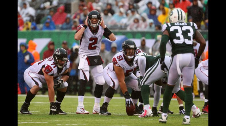 Quarterback Matt Ryan of the Atlanta Falcons at the line of scrimmage against the New York Jets. (Photo by Al Bello/Getty Images)