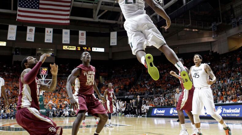 Miami's Erik Swoope (21) goes to the basket against Florida State during the first half of an NCAA college basketball game in Coral Gables, Fla., Sunday, Jan. 27, 2013. (AP Photo/Alan Diaz)