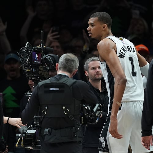 San Antonio Spurs forward Victor Wembanyama (1) reacts after he was ejected for a flagrant foul during the first half of Game 4 of an NBA basketball second-round playoffs series against the Minnesota Timberwolves in Minneapolis, Sunday, May 10, 2026. (AP Photo/Abbie Parr)