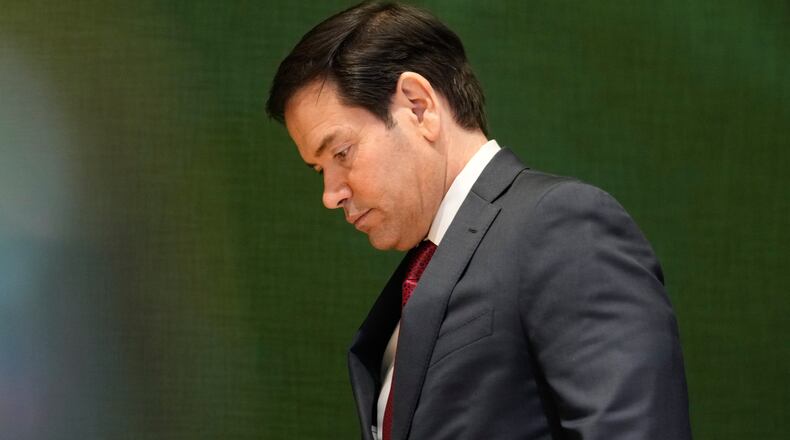 United States Secretary of State Marco Rubio walks down stairs after a meeting during the Annual Meeting of the World Economic Forum in Davos, Switzerland, Wednesday, Jan. 21, 2026. (AP Photo/Markus Schreiber)