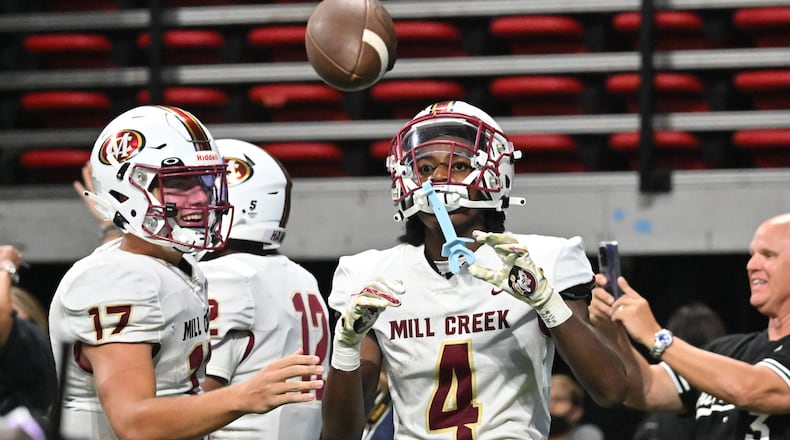 August 20 , 2022 Atlanta - Mill Creek's Makhail Wood (4) celebrates after scoring the game winning touchdown during the 2022 Corky Kell Classic at Mercedes Benz Stadium on Saturday, August 20, 2022. Mill Creek won 44-41 over Walton. (Hyosub Shin / Hyosub.Shin@ajc.com)