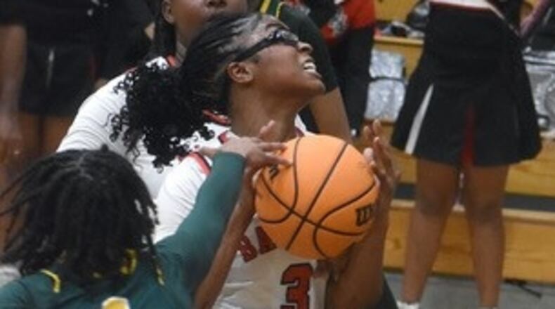 Baldwin High's Madison Ruff goes up for a shot against Griffin defenders in a regional final last week. Photo courtesy of The Union-Recorder.