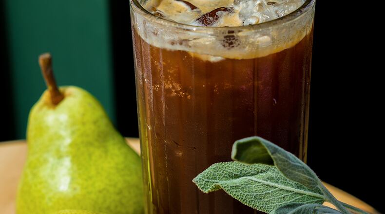 Spiller Park's pear sage espresso tonic, also known as PSWLU (Pear Sage We Love You), includes pear puree, sage syrup, lemon, seltzer water and espresso. Courtesy of Gloria McDuff/Spiller Park