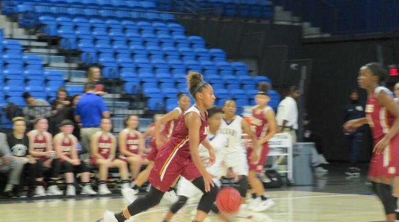 Rachel Suttle of the Holy Innocents' Lady Golden Lions drives toward the basket in their game against the Calvary Lady Cavaliers at UNG's Convocation Center in Dahlonega on Saturday, March 2, 2019. (Adam Krohn/special)