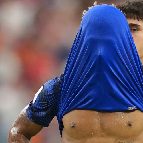 France's Desire Doue covers his face after his side's lost against in a World Cup semifinal soccer match in Arlington, Texas, near Dallas, Tuesday, July 14, 2026. (AP Photo/Julio Cortez)
