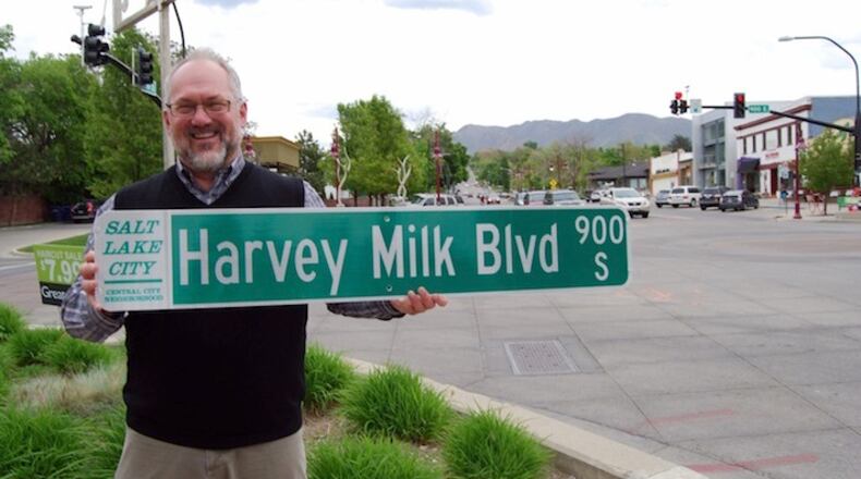 Openly gay Salt Lake City councilman Stan Penfold at 9th & 9th, heart of the city's gay community, with one of the new street signs. (Dan Weist/Salt Lake City Council)