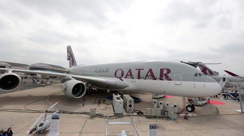 An Airbus SAS A380 aircraft, operated by Qatar Airways Ltd., stands on display on the opening day of the 51st International Paris Air Show in Paris, France, on Monday, June 15, 2015. The 51st International Paris Air Show is the world's largest aviation and space industry exhibition and takes place at Le Bourget airport June 15 - 21. Photographer: Jason Alden/Bloomberg