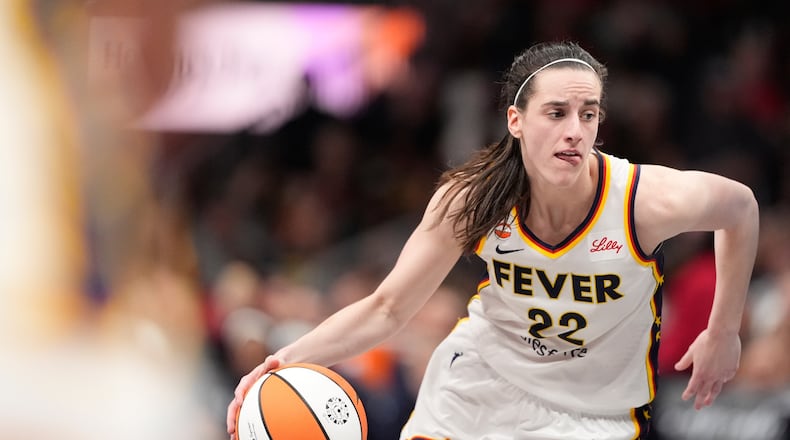 Indiana Fever guard Caitlin Clark (22) dribbles the ball in the second half of an WNBA basketball game against the Atlanta Dream Sunday, Aug. 16, 2026, in Atlanta. (AP Photo/Brynn Anderson)